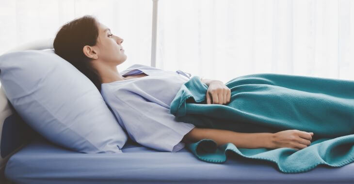 A woman sleeping with her head elevated.