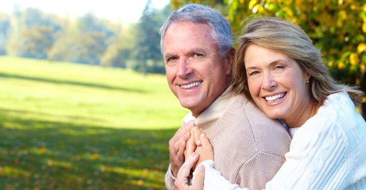 Happy senior couple with perfect smiles.