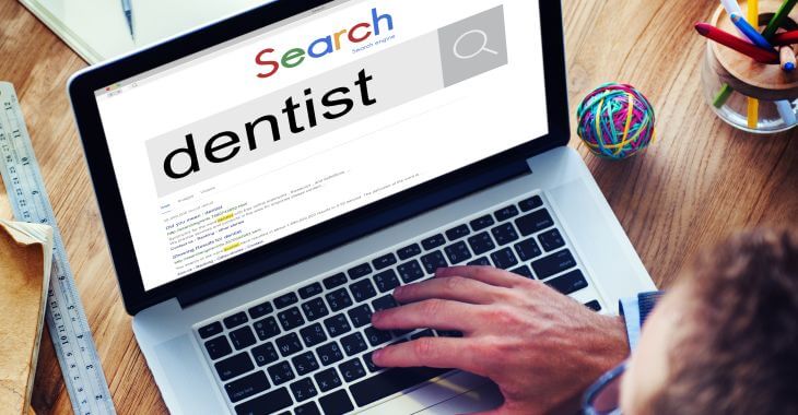 A man searching a dentist online.