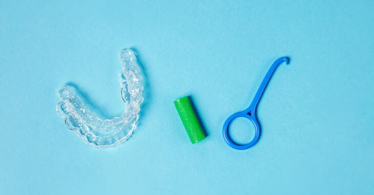 a set of clear aligners and chewies