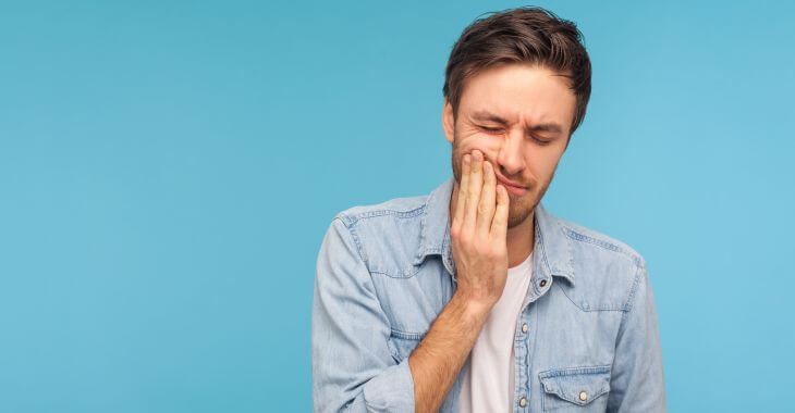 A man feeling toothache