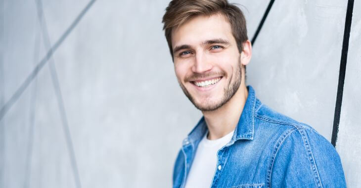 Young confident happy man with a perfect smile